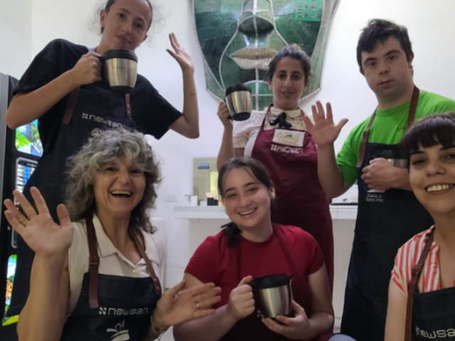 people in art class jazz hands greeting